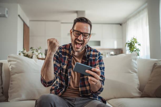 istock I enjoy playing a video game on my mobile phone 2161571059