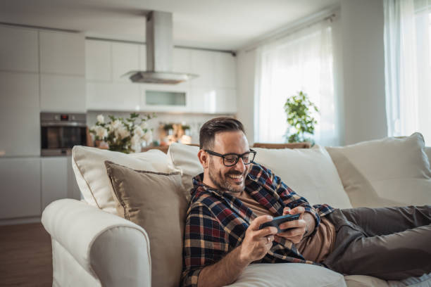 istock I enjoy playing a video game on my mobile phone 2161571060