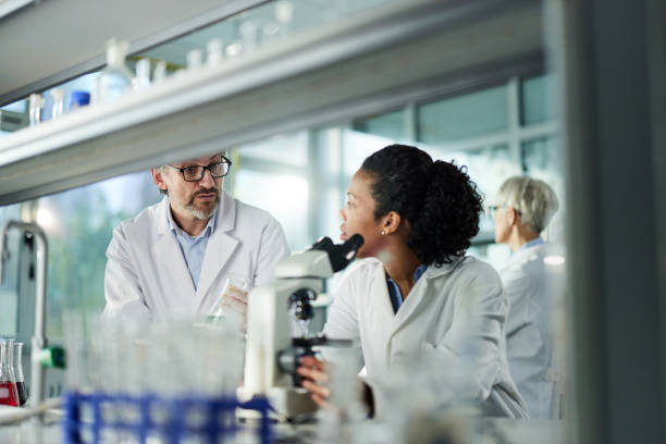 istock Group of medical experts working in laboratory. 2161571824