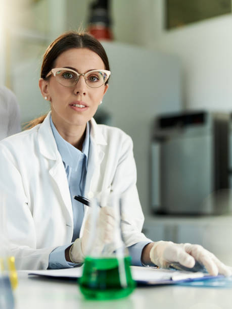 istock Young female scientist in laboratory. 2161571946