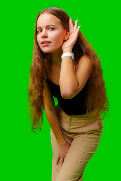 istock Woman Posing With Hand on Head Don't Hear 2161573601