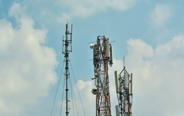 istock Multiple BTS Towers Against a Clear Blue Sky – Telecommunications Infrastructure 2161578505