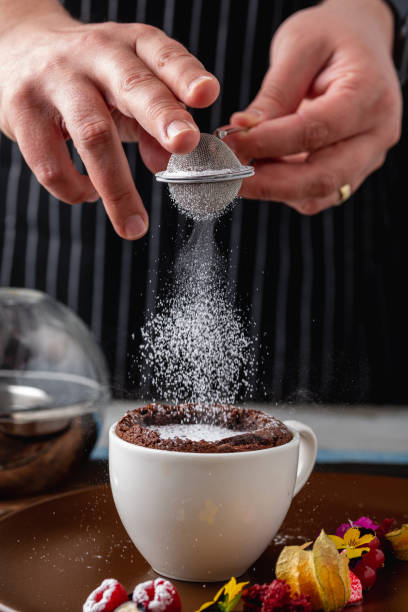 istock Chocolate souffle with flowing chocolate on a brown porcelain plate 2161580061