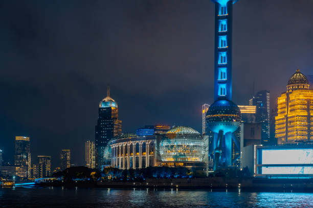 Urban skyscrapers in Shanghai at night;