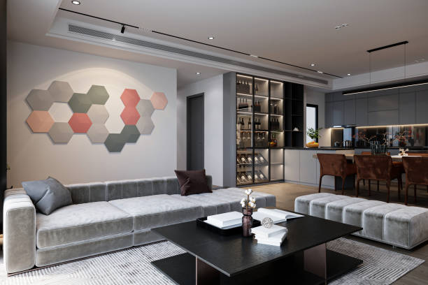 istock Photo delightful living space with a stylish sofa behind hexagon wall panel background. 2161588683