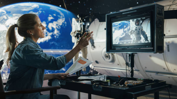 istock Female Director Filming a Sci-fi Movie Shoot Using Advanced Cgi and Virtual Production, Featuring an Astronaut on a Digital Set. Professional Crew Enhances the Immersive Space Adventure. 2161588997
