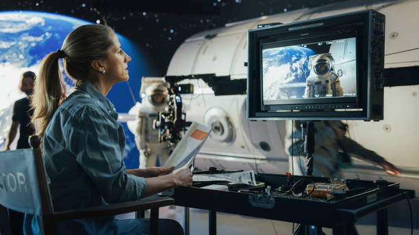istock Female Director Filming a Sci-fi Movie Shoot Using Advanced Cgi and Virtual Production, Featuring an Astronaut on a Digital Set. Professional Crew Enhances the Immersive Space Adventure. 2161589013