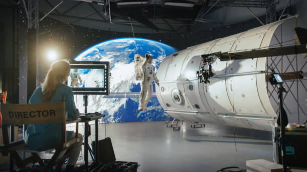 istock Successful Female Director Leads a Diverse Crew in Filming a Sci-fi Movie Using Virtual Production and Cgi, Featuring an Astronaut on a Futuristic Set With Advanced Equipment and Immersive Visuals. 2161589037