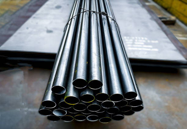 high quality steel pipes  in stack waiting for shipment in warehouse. Construction products on transport for industrial materials Construction engineering products.Steel group for industry material