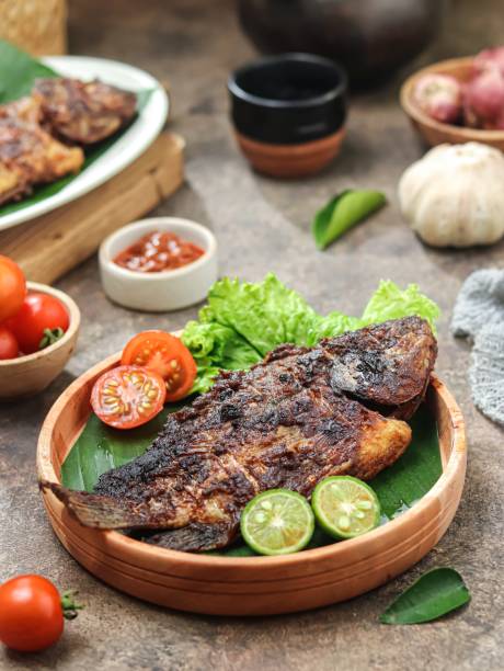 istock Ikan bakar, charcoal-grilled fish or other forms of seafood. 2161593536