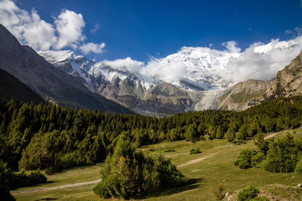istock Mountains, forests, and snow capped mountains under clear skies 2161594538