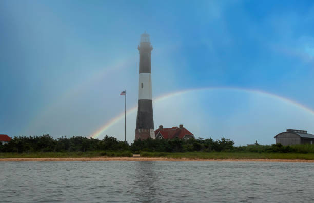 istock The Fire Island Lighthouse with a rainbow in the background 2161594647