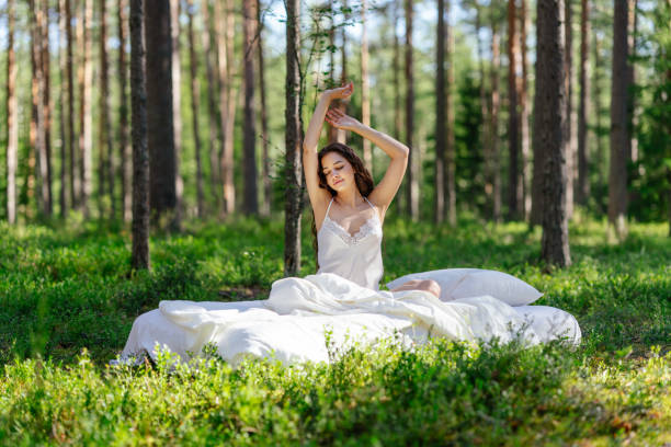 istock Girl wakes up in a summer forest 2161594678