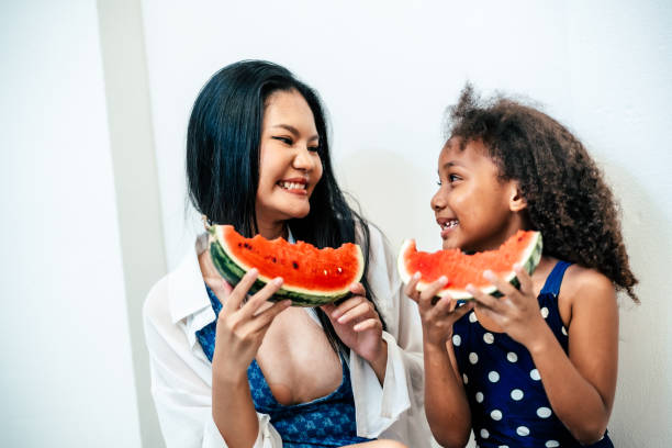 istock Family enjoying fresh watermelon 2161596278
