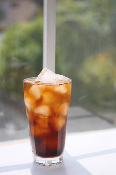 Preparing Iced Coffee Americano Served in a Glass