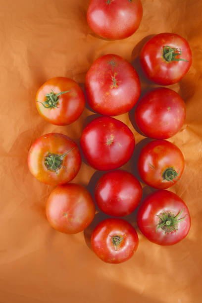 Close-up view of a pile of fresh red tomatoes