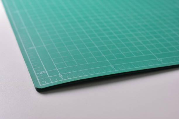 istock green cutting mat board on white background with line and scale measure guide pattern for object art design, tool equipment of diy craft work 2161599551