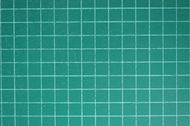 istock green cutting mat board background with line and scale measure guide pattern for object art design, tool equipment of diy craft work 2161600092