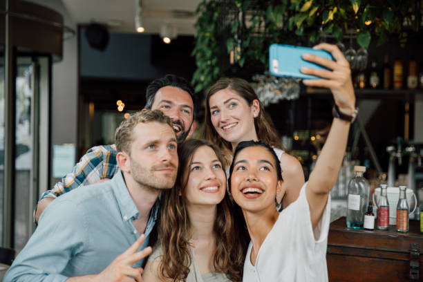 istock Friends in a modern bar & restaurant 2161600813