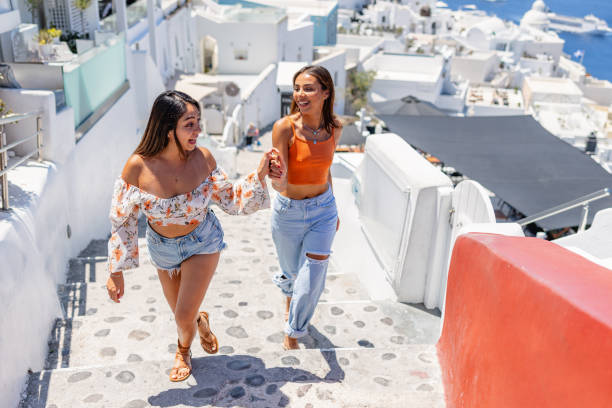 istock Joyful Young Women Exploring Santorini in Summer 2161601876
