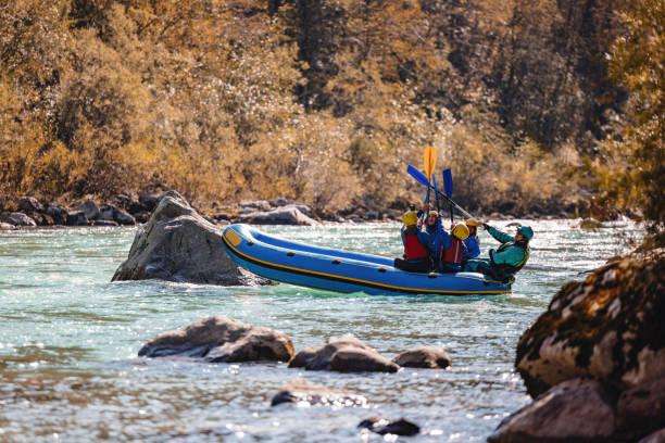 istock Family and Guide Whitewater Rafting on River 2161603465
