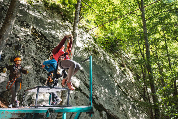 istock Adventure Seekers Starting a Zip Line Course in Lush Forest 2161605323