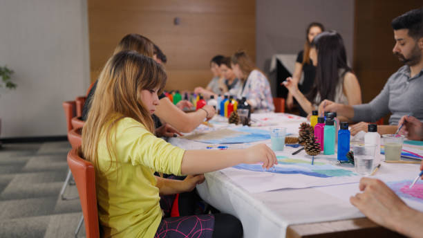 istock Group of multi-racial people with different ages joining art painting therapy session class 2161606385