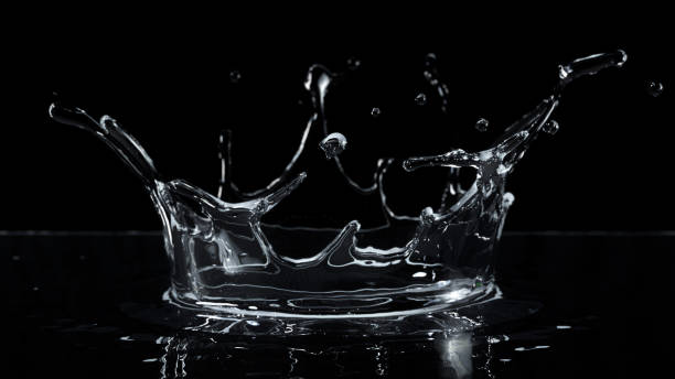 istock Closeup Water Droplet splashing on black background. 3D Render. 2161606536