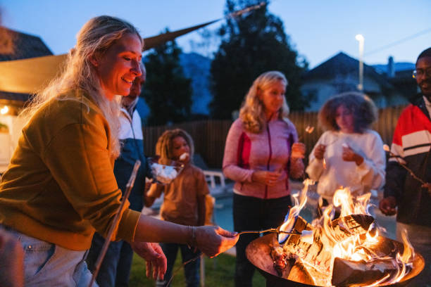 istock Diverse Multigenerational Group Enjoying a Backyard Campfire at Dusk 2161607216