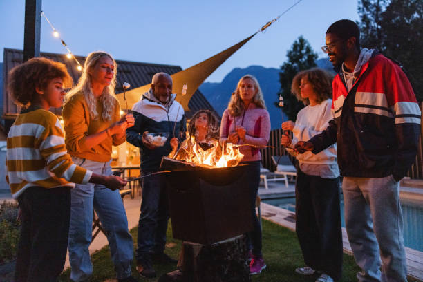 istock Diverse Multigenerational Family Enjoying a Campfire Outdoors at Twilight 2161607217