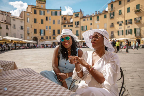 Two black female sisters sightseeing in Lucca