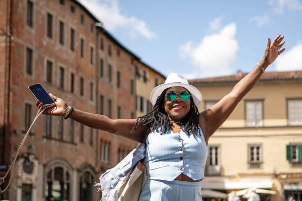 istock Black mature black woman sightseeing in Lucca 2161610272