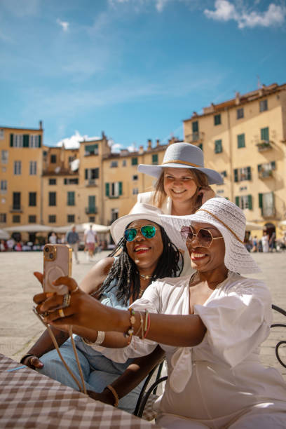 istock Three female friends sightseeing in Lucca 2161610378