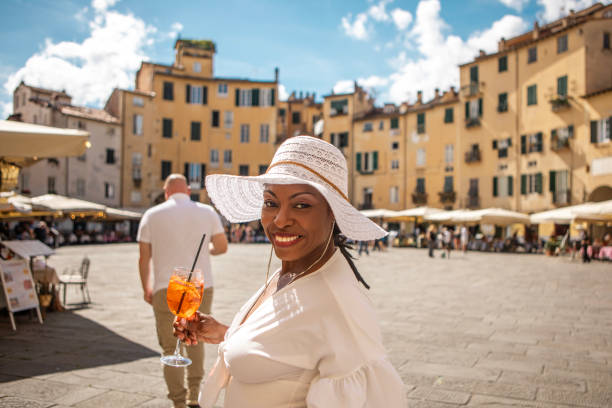 istock Luxury mature black woman sightseeing in Lucca 2161610512