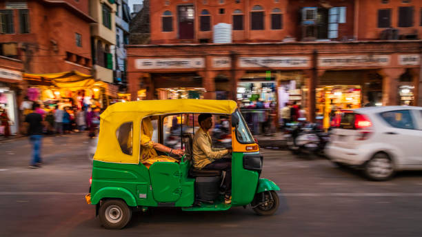 istock Indian man drives auto rickshaw (tuk-tuk), India 2161611030