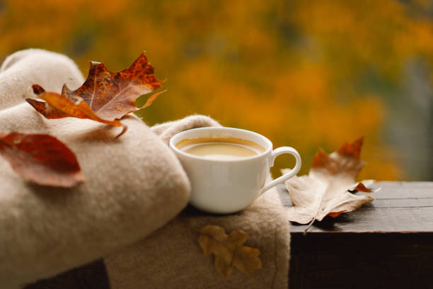 Hot coffee and autumn decor.