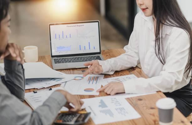 istock Business partners working with analysis report and advisor showing plan. 2161614590