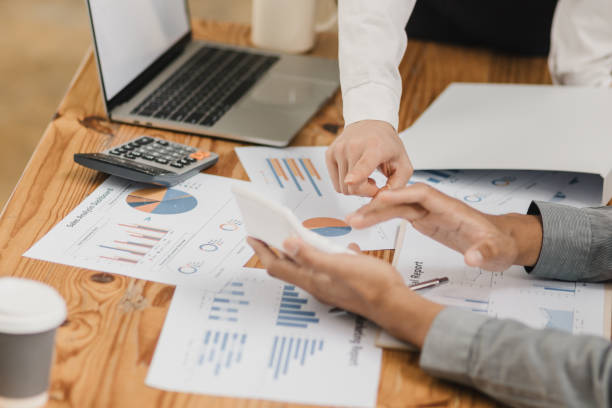 istock Business partners working with analysis report and advisor showing plan. 2161615130