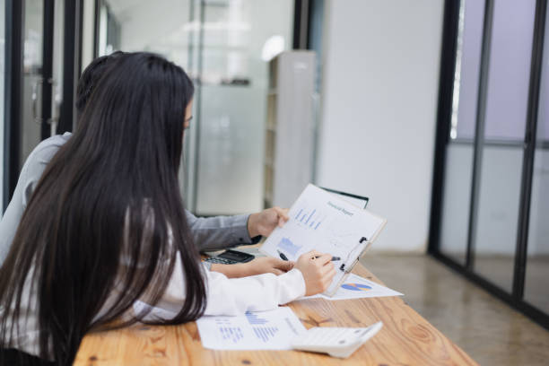 istock Business partners working with analysis report and advisor showing plan. 2161615200
