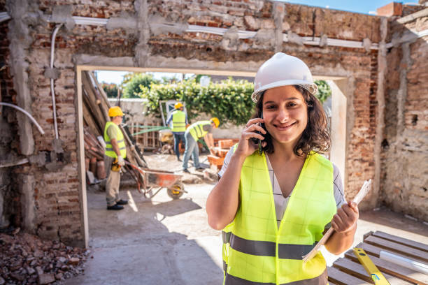 istock Portrait of a engineer talking on phone on a construction site 2161616836