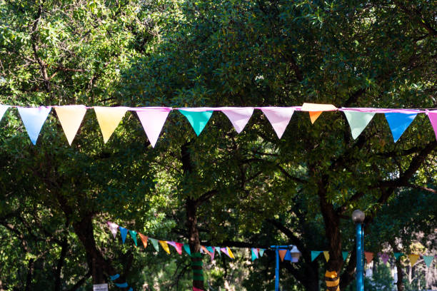 istock Colorful banners hung among the trees. 2161617479