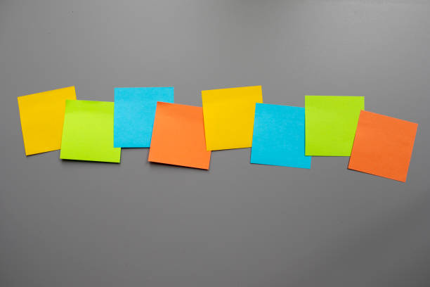 istock Row of eight blank adhesive notes 2161621008