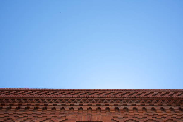 An old brick wall appears to be cut out of the sky in Lincoln Park, Chicago