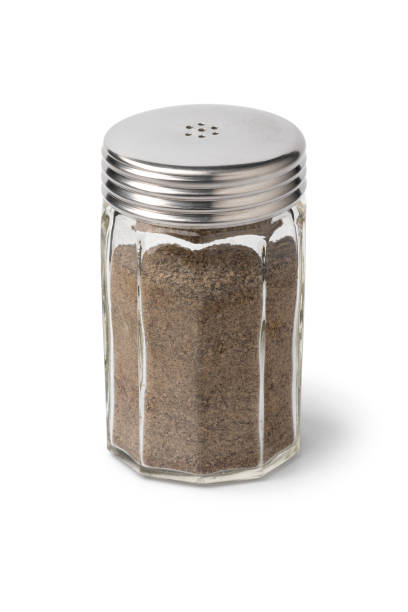 Single ground black pepper shaker isolated on white background close up