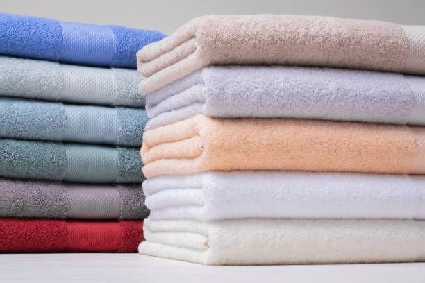 istock Colorful Towel Stacks Side by Side on White Background 2161625967