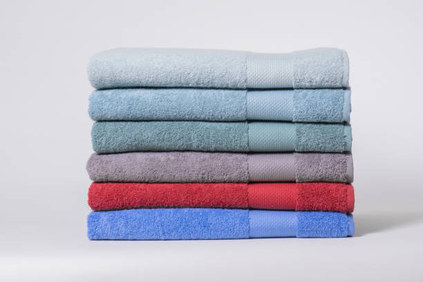 istock The stack of folded colorful towels against a white background. 2161626476