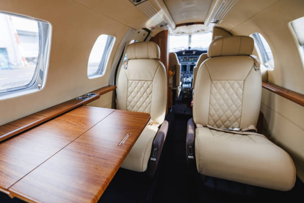 istock Luxury Private Jet Interior with Prestigious Leather Seats and Wooden Table 2161626567