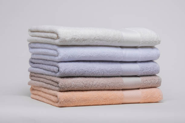 istock The stack of folded colorful towels against a white background. 2161626651