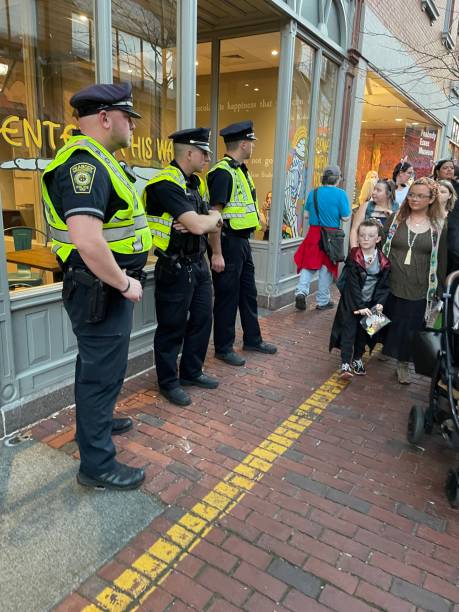 Salem MA, USA October 27 Police officers watch over the Halloween festival in Salem Massachusetts, ensuring all visitors are safe and protected
