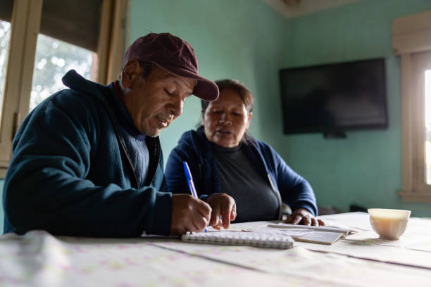 Woman teaching her husband how to read